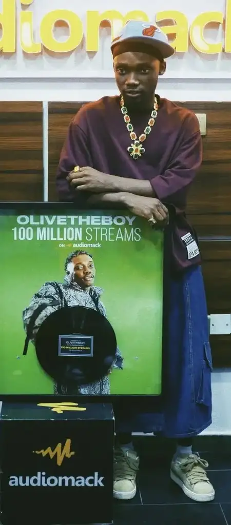 OliveTheBoy officially receives plaque for 100m streams on Audiomack