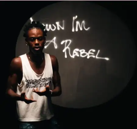 AlorG’s debut EP blends Afrobeat and personal struggles in ‘Down I’m A Rebel’ [Video]